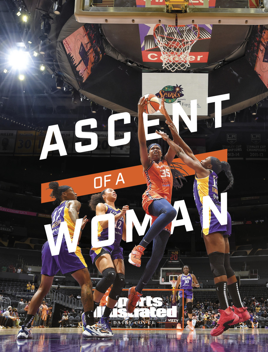 Jonquel Jones driving to the basket with the words Ascent of a Woman